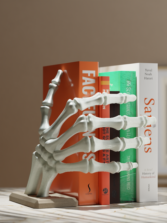 Realistic 3D printed skeleton hand holding books modern home decor
